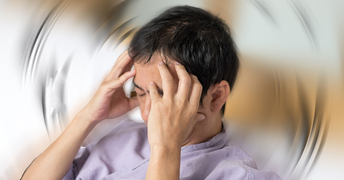 vertigo-illness-concept-man-hands-on-his-head-felling-headache